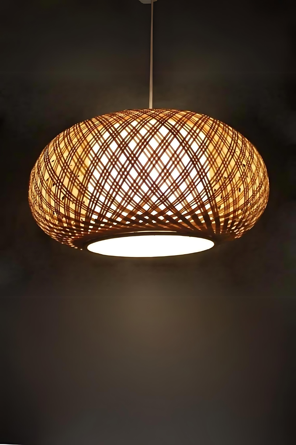 Handcrafted Traditional Rattan Pendant Light hanging in a cozy living room.