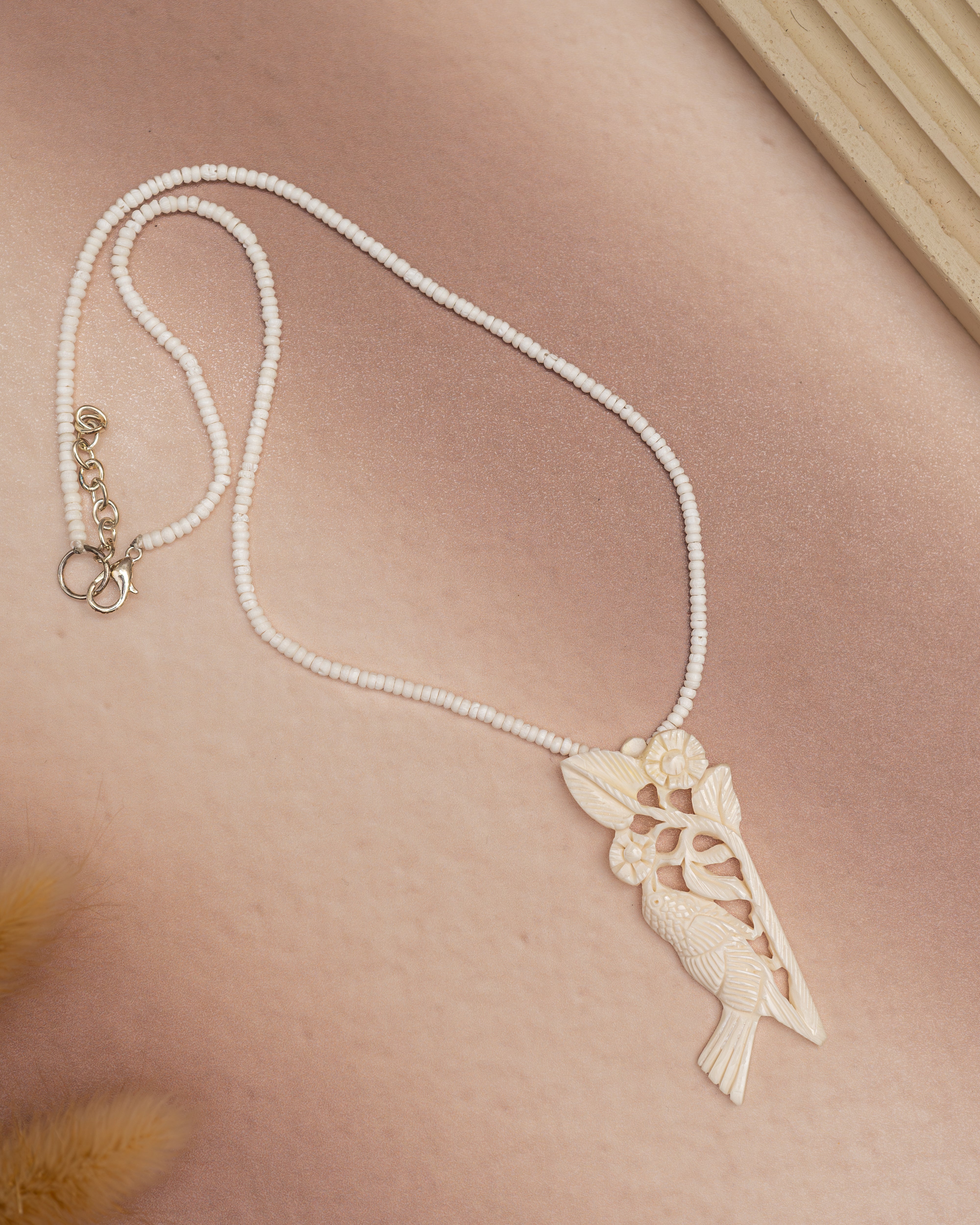 Bone Necklace with Bird-Themed Pendant