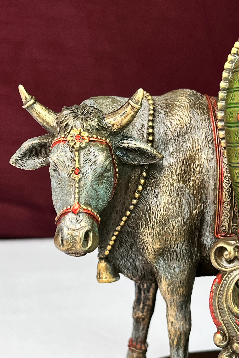 Handcrafted Polyresin Bronze Finish Lord Krishna Idol beautifully displayed on a shelf.