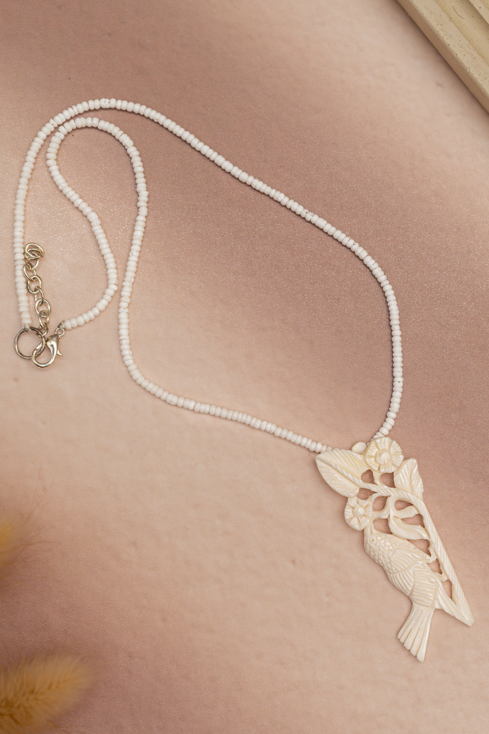 Bone Necklace with Bird-Themed Pendant